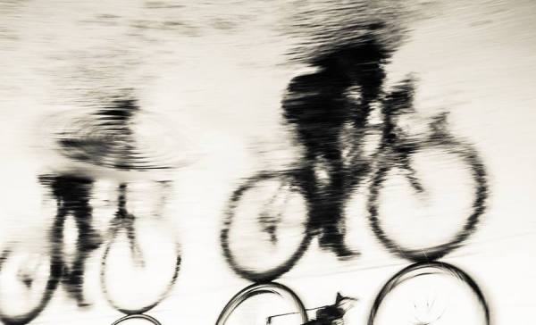 Photograph Andrew Lever Refelcted Cyclists on One Eyeland